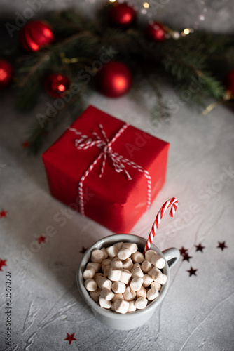 Mugs with hot drink and gingerbread cookie.