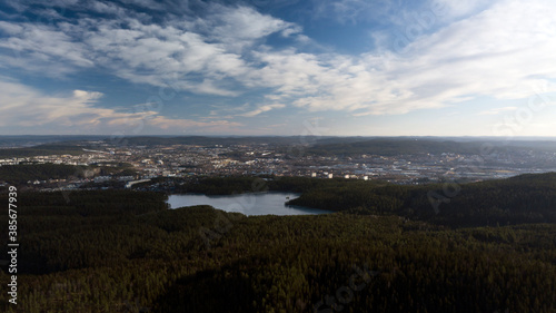 Canvas Print Aerial scene of forest and lake with the suburbs of Oslo city in the background