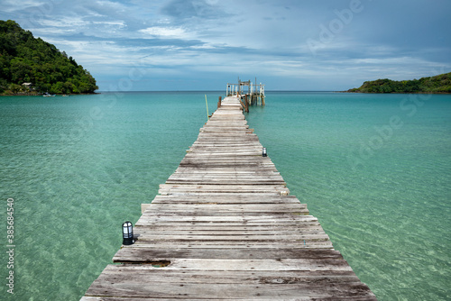 The scenery of the clear seawater and wooden bridge at Koh Kood island in Trat province, Thailand.