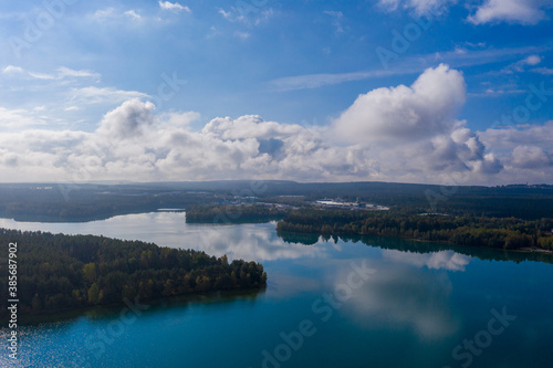 Drones panorama in the autumn lake landscape of the Upper Palatinate with turquoise blue water and sun reflections