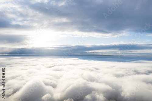 Aerial view white clouds in blue sky. View from drone. Aerial view cloudscape texture background. Texture of clouds. View from above. Panorama clouds background