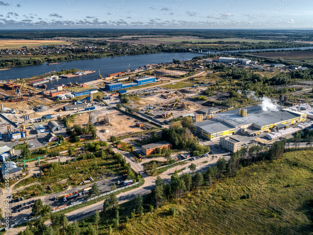 industrial plant on the bank of a large river, aerial view. industrial plant on the bank of a large river, aerial view.