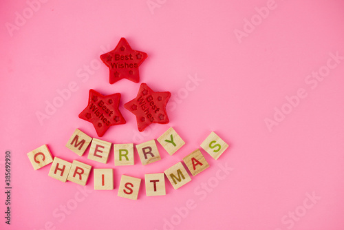 Happy New Year and Merry Christmas. Scrabble letters, playdough and plasticine. Letter tiles spelling celebration holiday.