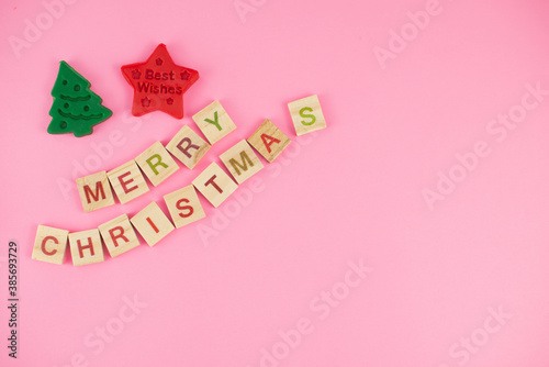 Happy New Year and Merry Christmas. Scrabble letters, playdough and plasticine. Letter tiles spelling celebration holiday.