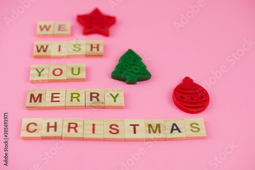 Happy New Year and Merry Christmas. Scrabble letters, playdough and plasticine. Letter tiles spelling celebration holiday.