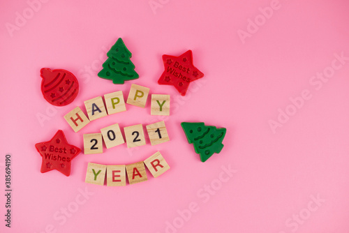 Happy New Year and Merry Christmas. Scrabble letters, playdough and plasticine. Letter tiles spelling celebration holiday.