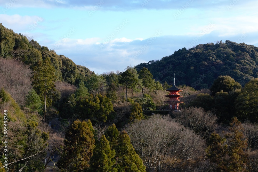 orange temple in the middle of the forest