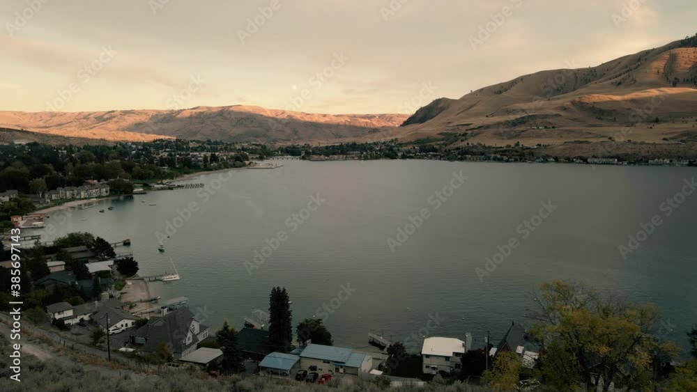 Evening Aerial of Lake Chelan Town Flying Through Wood Frame from