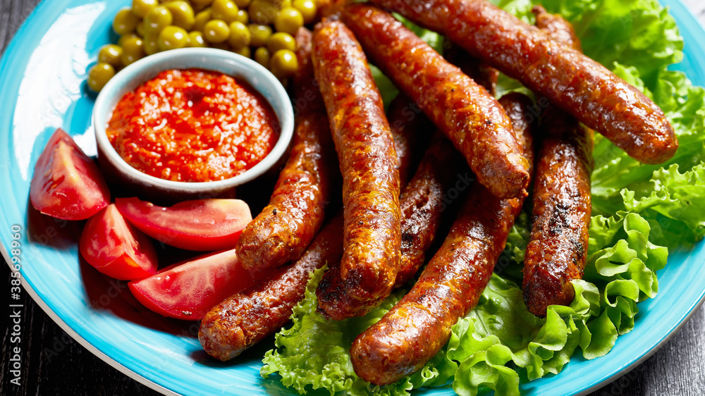 English meal: pork sausages with peas and lettuce English meal: pork sausages with peas and lettuce