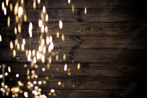 Golden bokeh lights with wooden background