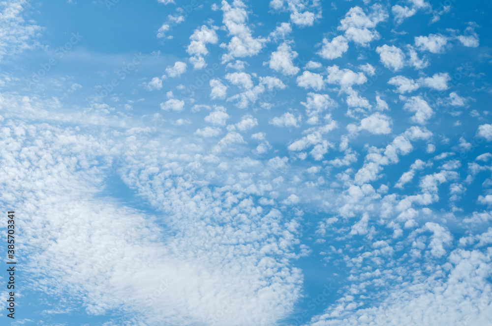 White clouds on blue sky as cloudy background