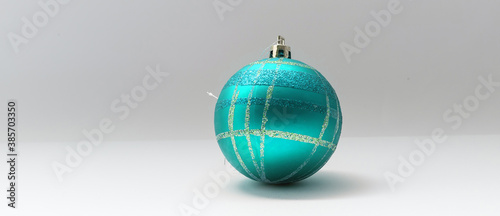 Single blue Christmas tree ball decoration isolated over the white background 