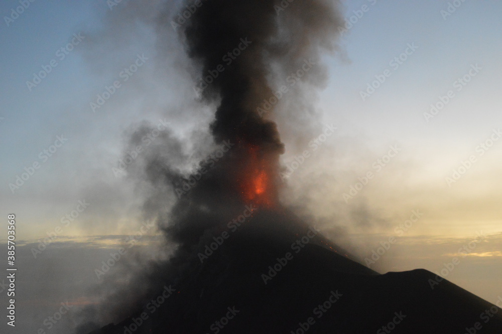 Fototapeta premium The volcano Fuego erupting with exploding lava, magma and ashes in Guatemala