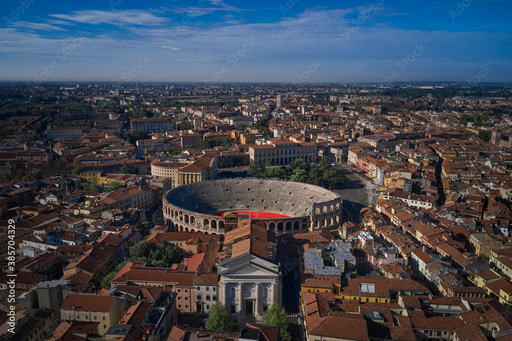 Aerial drone photo from iconic arena and city hall in Bra square of beautiful city of Verona.  Arena is a Roman amphitheatre in Piazza Brà, Italy. Verona Arena aerial panoramic view.