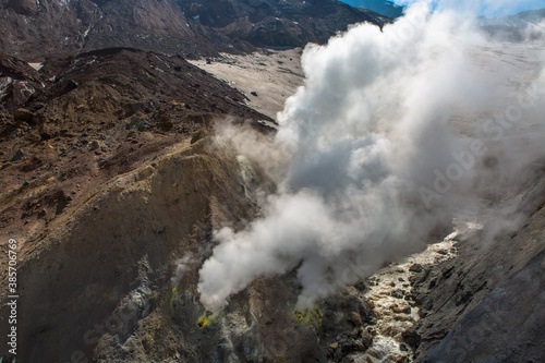 View of a volcanic slope with thermal steam exits to the surface