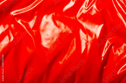 red smooth glossy weave. It can be used as a texture. Banner. Top view, flat lay