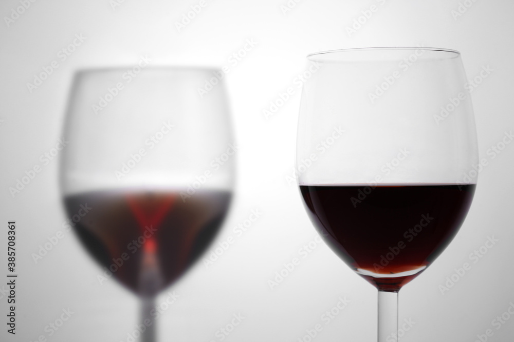 close up on a red wineglass on white background with copy space for your text close up on a red wineglass on white background with copy space for your text