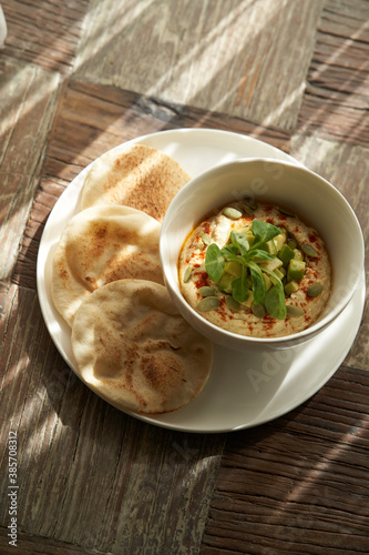 Hummus with avocado and herbs