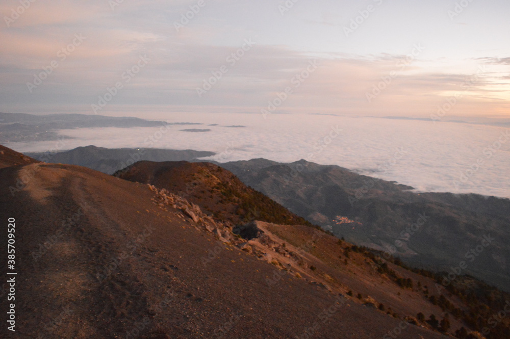 Sunrise hiking and camping on the top of the active Volcan Acatenango while the Volcano Fuego is erupting - Guatemala Sunrise hiking and camping on the top of the active Volcan Acatenango while the Volcano Fuego is erupting - Guatemala