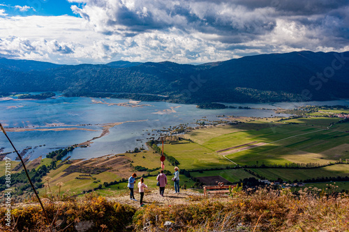 landscape with Cerknica lake and Alps mountains in autumn