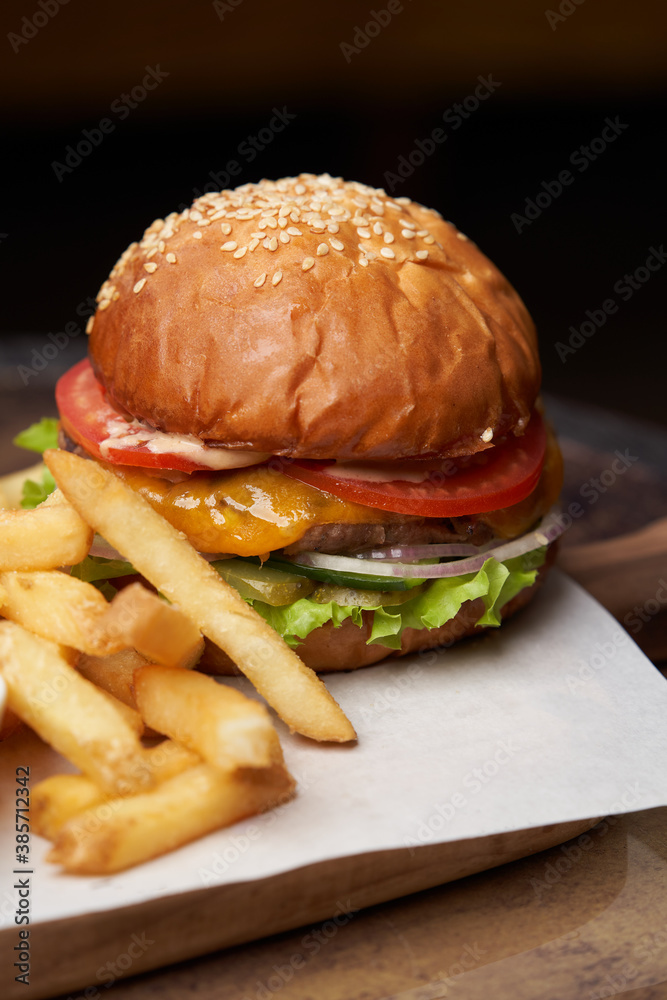 Cheeseburger with french fries and sauces