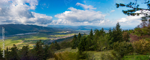 panorama landscape with mountains, lake and blue sky