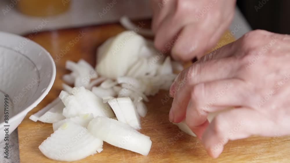 Cut the onion into slices with a knife Cut the onion into slices with a knife