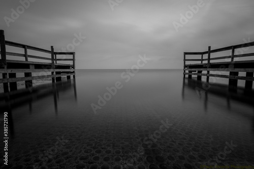 tranquil view of docks by lake