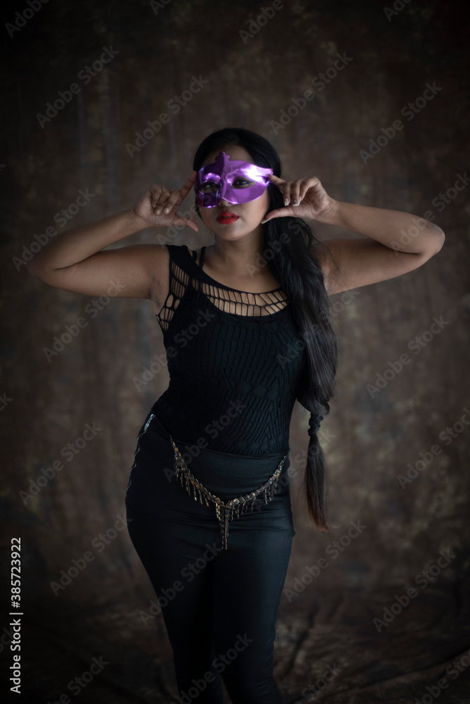 Studio portrait of an young Indian girl in black western dress in front of textured background. Fashion portrait photography Studio portrait of an young Indian girl in black western dress in front of textured background. Fashion portrait photography