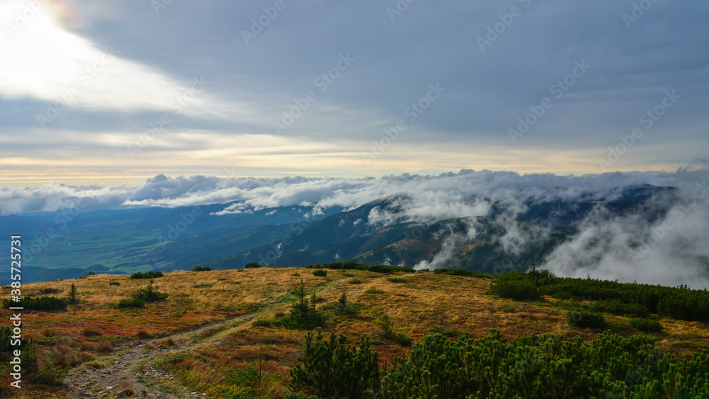 Small clouds rolling over a mountain ridge, Low Tatras, Slovakia.