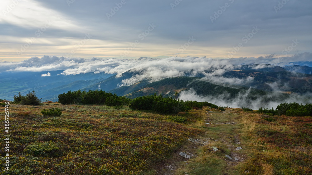 Small clouds rolling over a mountain ridge, Low Tatras, Slovakia.