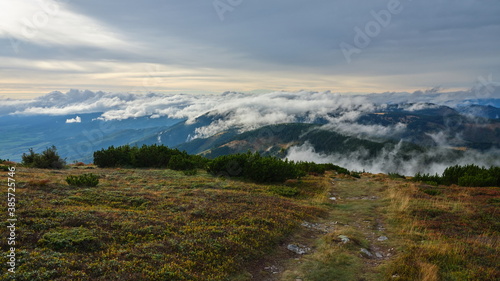 Small clouds rolling over a mountain ridge  Low Tatras  Slovakia.