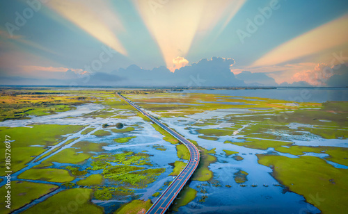 Aerial view of Chalerm Phra Kiat road at daytime in Thale Noi, Phatthalung, Thailand photo