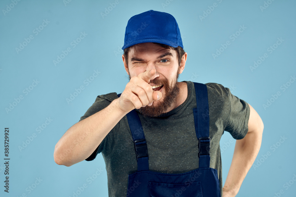 man in work uniform uniform professional work lifestyle delivery service blue background man in work uniform uniform professional work lifestyle delivery service blue background