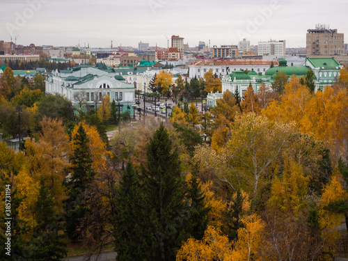 Victory Square, Dzerzhinsky Square, Museum of Fine Arts and Drama Theater in Omsk in autumn from above. Yellow trees