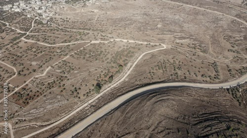 Israel Palestine border in Jerusalem - aerial view
drone image divide Beit hanina (Abu Dahuk) and Ramat Shlomo neighborhoods northwest East Jerusalem 
 photo