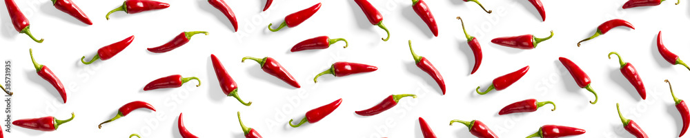 Creative background made of red chili or chilli on white backdrop. Minimal food backgroud. Red hot chilli peppers background. Creative background made of red chili or chilli on white backdrop. Minimal food backgroud. Red hot chilli peppers background.