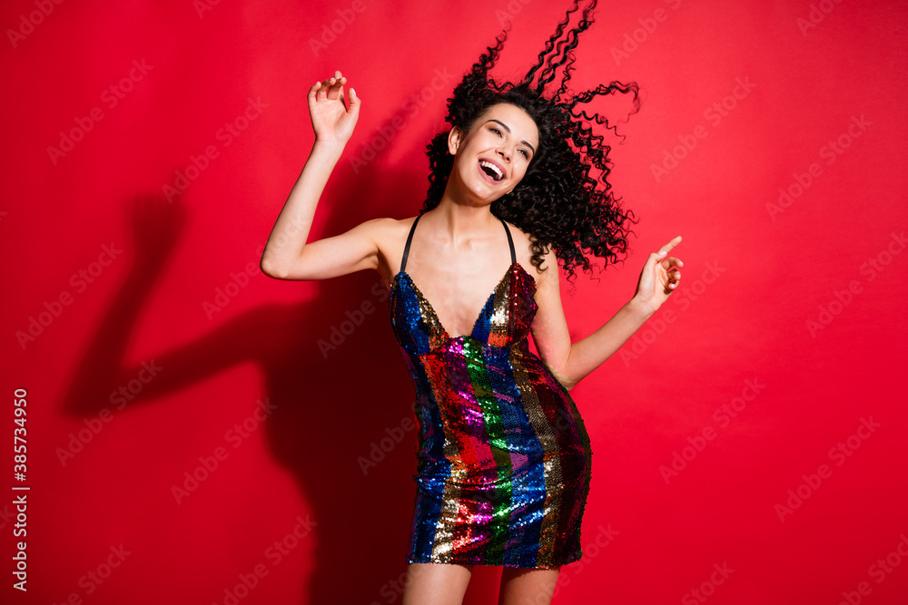 Naklejka premium Portrait of stunning cheerful glad wavy-haired girl dancing disco bachelorette isolated on bright red color background