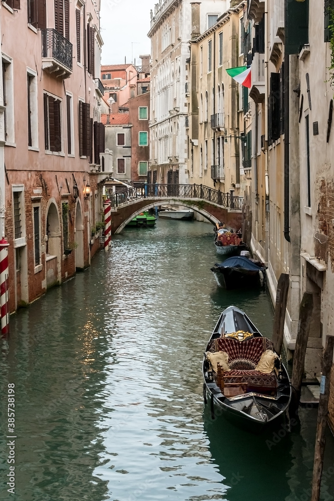 Canale (water canal) with traditional gondola boat in Venice (Venezia), Italy, Europe