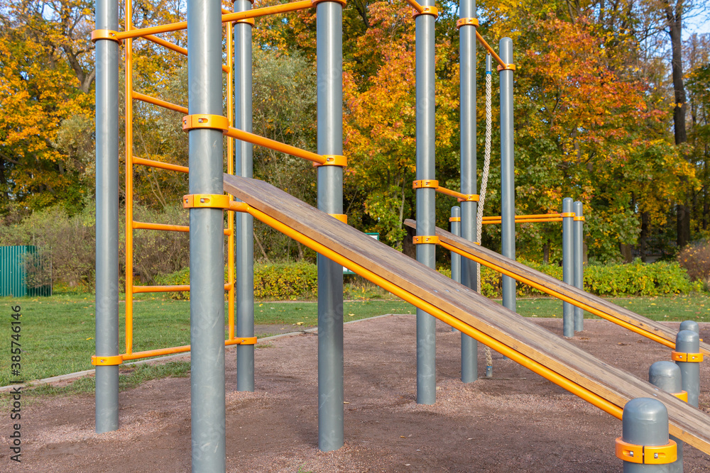 Modern sports training complex in the autumn park Modern sports training complex in the autumn park