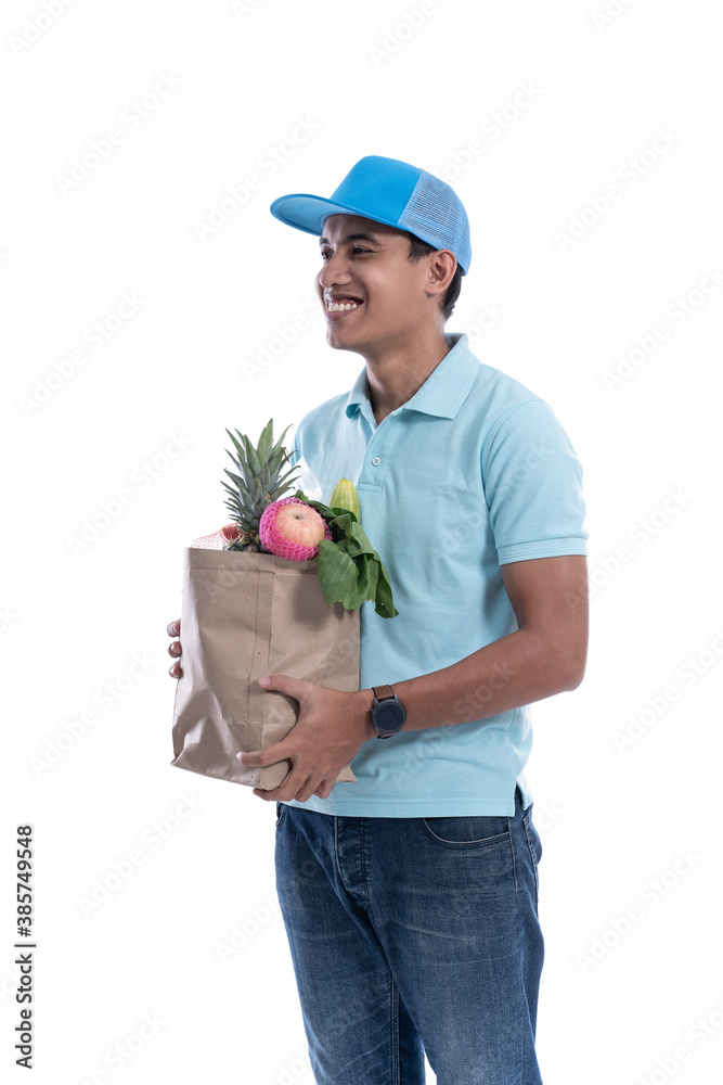 online grocery store. online driver courier carrying groceries. delivery service isolated over white background online grocery store. online driver courier carrying groceries. delivery service isolated over white background