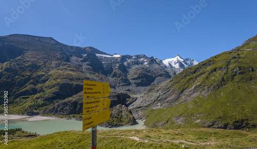 Rural landscape in Alps with the highest mountain from Austria in background Grossglockner (3797 m. elevation)