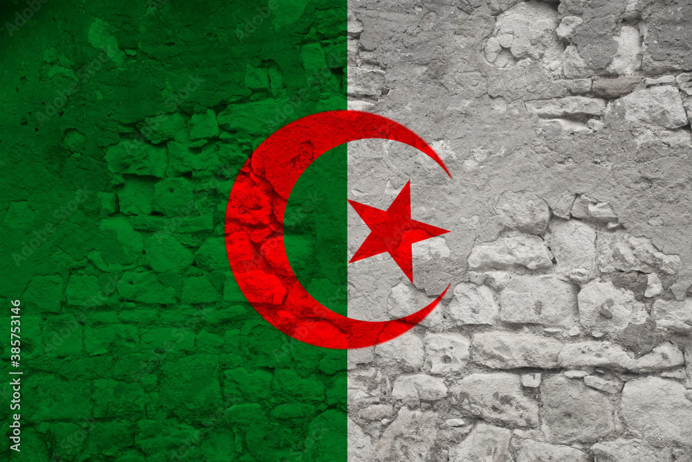 seamless panorama of the national flag of the state of algeria on an old stone wall with cracks, the concept of tourism, emigration, economy, politics, civil rights and freedoms seamless panorama of the national flag of the state of algeria on an old stone wall with cracks, the concept of tourism, emigration, economy, politics, civil rights and freedoms