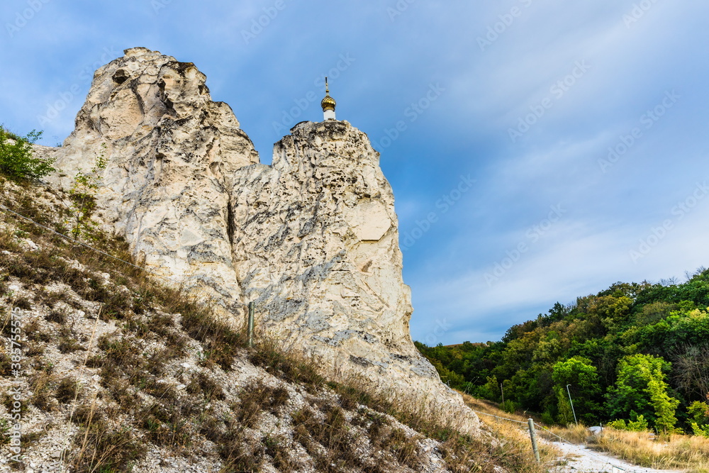 Fototapeta premium a plateau and open-air museum on the right bank of Don River, a steppe with remains of chalk pillars or limestone outcrops, known for its cave temples. Russia