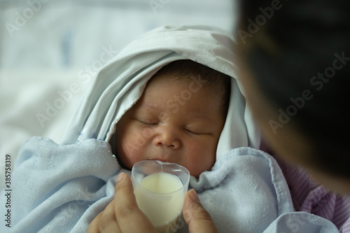 New Born Baby Girl  Drinking Milk from Cup