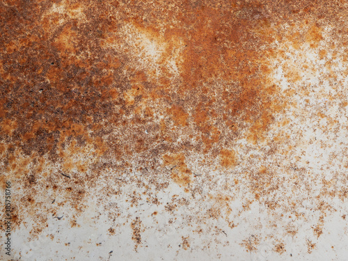 White and orange rusty background. Old rusty metal sheet. Brown grunge texture.