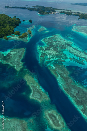 Fototapeta Naklejka Na Ścianę i Meble -  Aerial shot of tidal channel, coral reef and islands in Palau, Micronesia