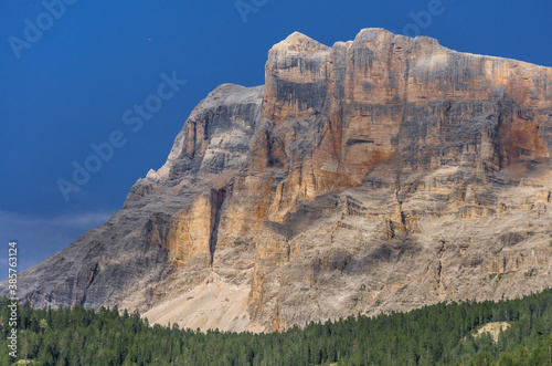 Late afternoon deep color view of Sasso di Santa Croce mountain range west wall and Mount Cavallo from La Villa village in Val Badia (valley), Eastern Dolomites, Alta Badia, South Tirol, Italy.