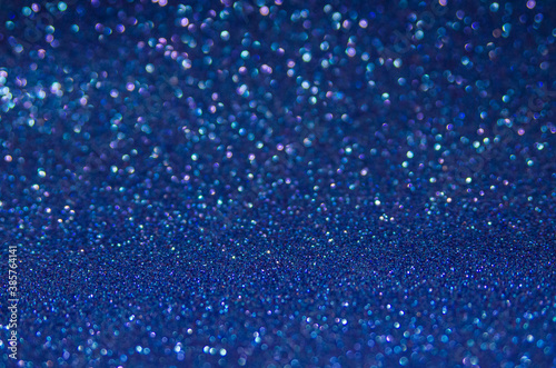 Unframed blue glitter abstract background. glitters defocused