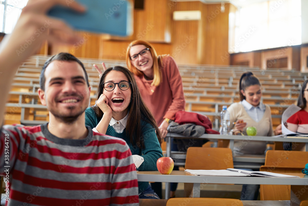 Group of students taking selfie at the lecture break Group of students taking selfie at the lecture break